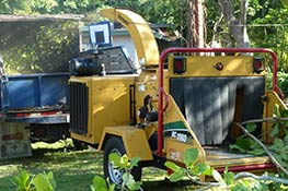 
 Wood chipper at work by JA Roman Tree service